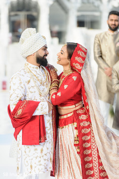 Indian bride and groom having a tender moment Indian bride and groom having a tender moment