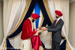 Indian groom getting his ceremonial sword capture. Indian groom getting his ceremonial sword capture.