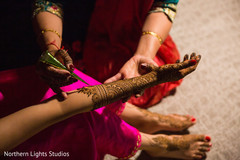 Indian bride getting her mehndi art done. Indian bride getting her mehndi art done.