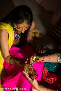 Mehndi artist at work being done. Mehndi artist at work being done.