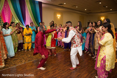 Indian groom dancing at sangeet capture. Indian groom dancing at sangeet capture.