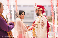 Indian bride and groom face to face at the wedding ceremony ritual. Indian bride and groom face to face at the wedding ceremony ritual.