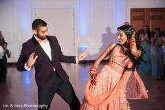 Indian bride and groom performing at the reception Indian bride and groom performing at the reception