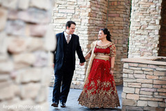 Indian couple posing for pictures outdoors Indian couple posing for pictures outdoors