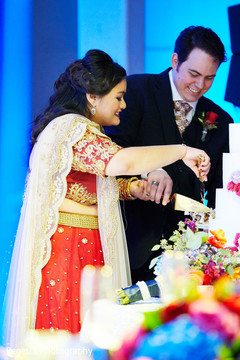 Indian lovebirds cutting the cake Indian lovebirds cutting the cake