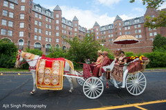 Indian bride and groom riding a carriage Indian bride and groom riding a carriage
