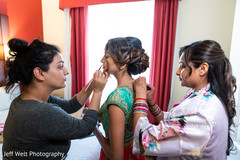 Lovely Indian bride getting her makeup done. Lovely Indian bride getting her makeup done.