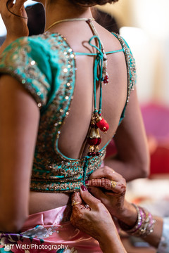 Indian bride getting her open shirt lehenga. Indian bride getting her open shirt lehenga.