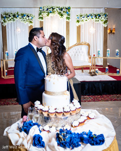 Indian lovebirds reception cutting cake moment. Indian lovebirds reception cutting cake moment.