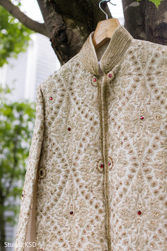 Sherwani on the hanger waiting for ceremony Sherwani on the hanger waiting for ceremony