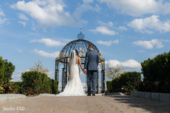 Indian newlyweds outdoors by the mandap Indian newlyweds outdoors by the mandap