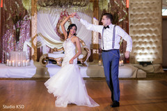 Indian lovebirds shining in the dance floor Indian lovebirds shining in the dance floor