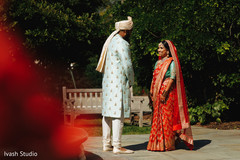 Sweet and lovely Indian bride and groom's first look scene. Sweet and lovely Indian bride and groom's first look scene.