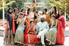 Indian couple with bridesmaids outdoors photo. Indian couple with bridesmaids outdoors photo.