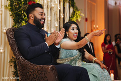 Joyful Indian bride and groom at their reception party. Joyful Indian bride and groom at their reception party.