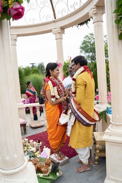 Indian lovebirds holding hands during the Gath Bandhan. Indian lovebirds holding hands during the Gath Bandhan.