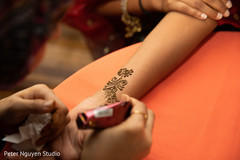 Indian bride getting her mehndi art done. Indian bride getting her mehndi art done.
