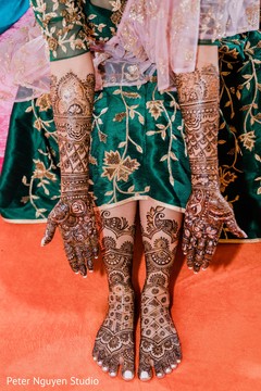 Stunning Indian bridal mehndi art on her hands and feet. Stunning Indian bridal mehndi art on her hands and feet.