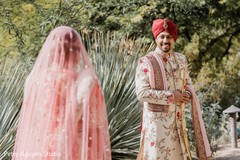 Cute Indian bride and groom's first look capture. Cute Indian bride and groom's first look capture.