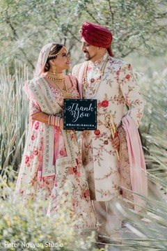 Lovely Indian couple on their ceremony wedding outfits. Lovely Indian couple on their ceremony wedding outfits.