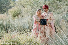 Adorable Indian couple holding thank you sign. Adorable Indian couple holding thank you sign.