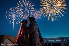 Delightful indian couple next to wedding fireworks photo. Delightful indian couple next to wedding fireworks photo.