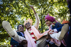 Indian groom being lifted by groomsmen Indian groom being lifted by groomsmen
