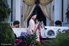 Indian bride and groom posing outdoors Indian bride and groom posing outdoors