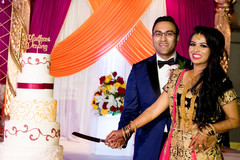 Indian bride and groom cutting cake moment. Indian bride and groom cutting cake moment.