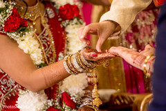 Indian bride getting a red mark on her hand. Indian bride getting a red mark on her hand.