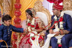 Indian bride getting petals from pageboy capture. Indian bride getting petals from pageboy capture.