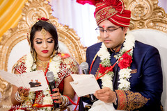 Indian bride and groom giving their vows. Indian bride and groom giving their vows.