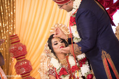 Maharani getting the Pithi red mark on her forehead. Maharani getting the Pithi red mark on her forehead.