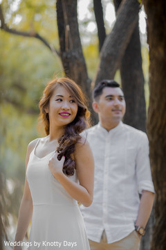 See this Indian bride posing with Raja by the trees See this Indian bride posing with Raja by the trees