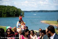 Indian groom riding the horse during the baraat Indian groom riding the horse during the baraat
