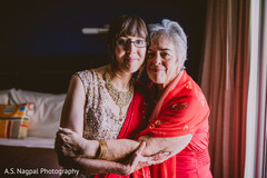 Lovely Indian bride with mother's portrait. Lovely Indian bride with mother's portrait.