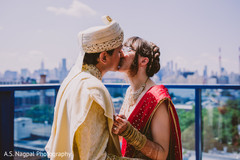 Lovely Indian groom kissing bride photo session. Lovely Indian groom kissing bride photo session.