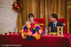 Indian couple at their wedding reception table. Indian couple at their wedding reception table.