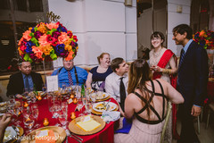 Indian couple sharing with guests. Indian couple sharing with guests.