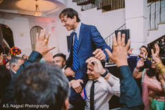 Rajah being lifted by groomsmen at reception. Rajah being lifted by groomsmen at reception.