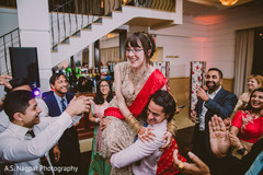 Maharani being lifted by groomsmen at reception party. Maharani being lifted by groomsmen at reception party.