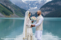Indian bride and groom meeting by the lake Indian bride and groom meeting by the lake