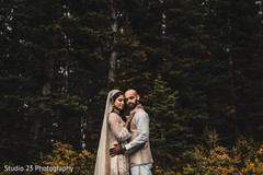 Indian bride hugging the Raja outdoors Indian bride hugging the Raja outdoors