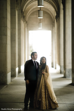 Elegant Indian couple in their reception outfits. Elegant Indian couple in their reception outfits.