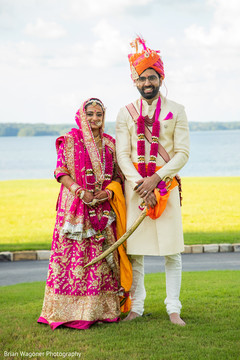 Indian bride and groom posing outdoors Indian bride and groom posing outdoors