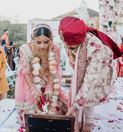 Indian bride and groom pouring offerings to sacred fire. Indian bride and groom pouring offerings to sacred fire.