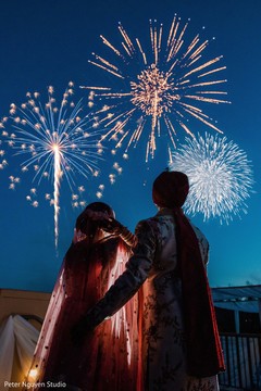 Indian bride and groom looking at fireworks capture. Indian bride and groom looking at fireworks capture.