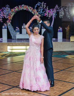Indian bride and groom sliding through the dance floor Indian bride and groom sliding through the dance floor