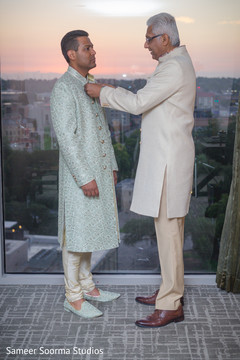 Indian groom being assisted by special guest Indian groom being assisted by special guest