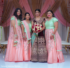 Beautiful Indian bridesmaids posing with the Maharani Beautiful Indian bridesmaids posing with the Maharani